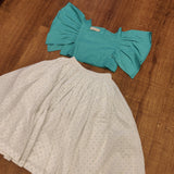 White skirt with blue dots and crop top with flare sleeves